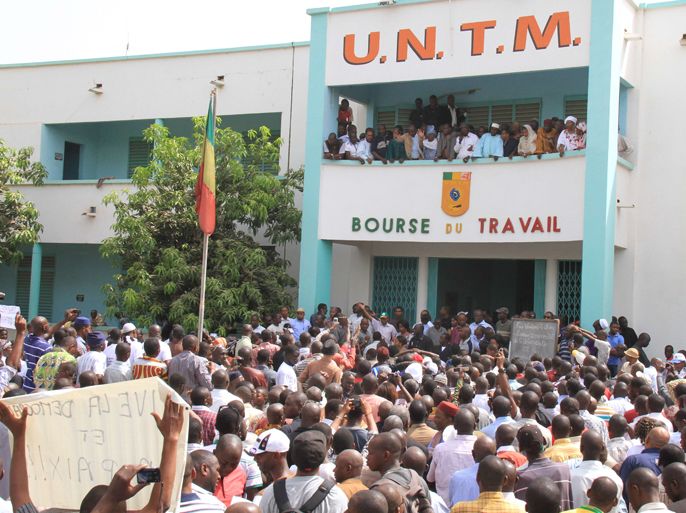 Demonstrators protest outside the "Bourse du Travail" in Bamako on March 26, 2012 against the military junta that took over the reigns of the country last week. The International Crisis Group today urged the international community to act quickly to end a military junta in Mali, which ousted one of the region's successful democracies.