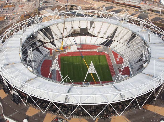 epa03040418 A handout picture released by the Olympic Delivery Authority (ODA) on 21 December 2011 shows an aerial view of the Olympic Stadium at the Olympic Park in London, Britain, 05 December 2011. Parts of the track are covered to protect it during overlay work by LOCOG required to turn the stadium into an Olympic venue. The Olympic Park is now over 90 per cent complete with the ODA on track to hand the site over to LOCOG early 2012. EPA/ANTHONY CHARLTON - LOCOG HANDOUT EDITORIAL USE ONLY/NO SALES