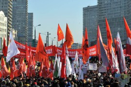 Demonstrators hold the red flags of communists and leftists as they take part in anti-Putin rally in the central Arbat area in Moscow, on March 10, 2012. Russia's protest movement against Russia's Prime Minister Vladimir Putin