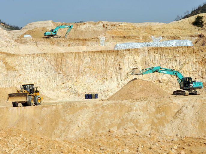 epa03097481 (FILE) A file picture made available on 09 February 2012 shows a rare earth mine in Ganxian county in central China's Jiangxi province on 30 December 2010. China exported 14,750 tons of rare earth in the first 11 months of 2011, meeting only about half of the total quota for exports for 2011. CHINA OUT