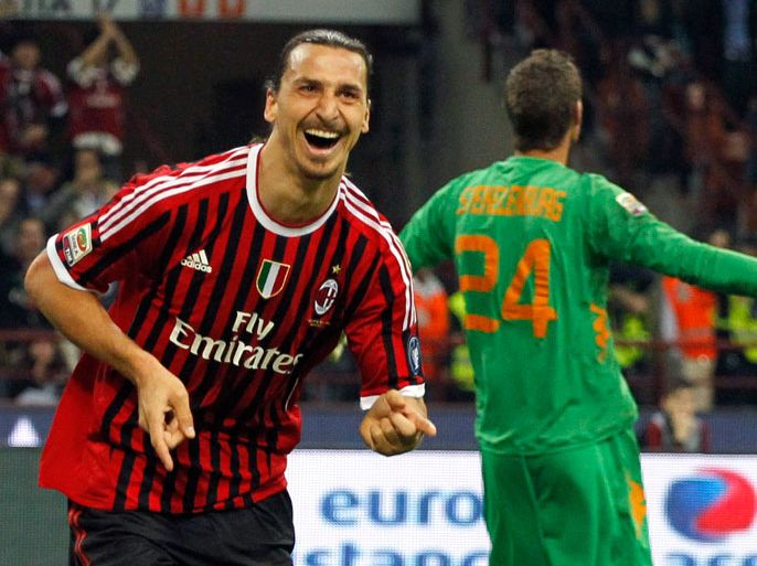 AC Milan's Zlatan Ibrahimovic reacts after scoring against AS Roma during their Italian Serie A soccer match at the San Siro stadium In Milan March 24, 2012. REUTERS/Alessandro Garofalo (ITALY - Tags: SPORT SOCCER)