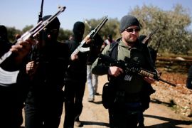 Syrian rebels, headed by their leader nick named " Abu Suleiman" (R) patrol and set up check-points in the north of northern Syria's Idlib region, on March 18, 2012