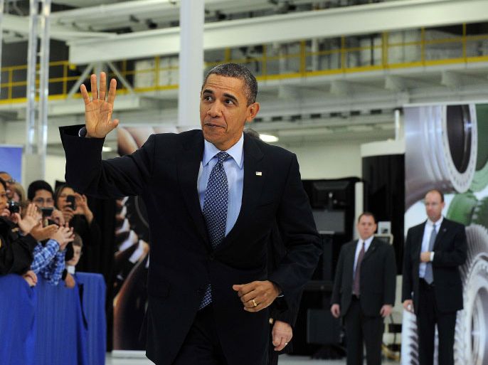 US President Barack Obama waves as he walks to the stage to speaks at the Rolls-Royce Crosspointe in Prince George, Virginia, on March 9, 2012. President Obama declared Friday that America "will thrive again" as another encouraging report on jobs growth delivered a new boost to his campaign for a second term. AFP Photo/Jewel Samad