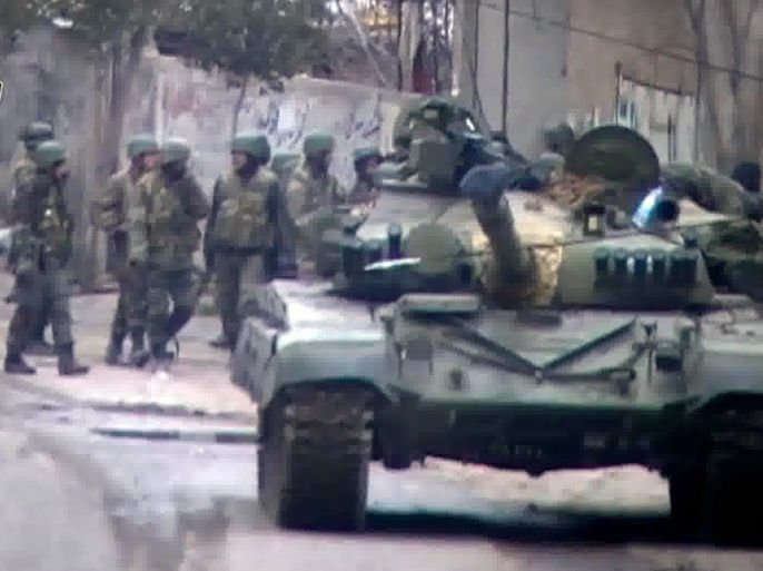 This image grab of footage uploaded on YouTube on March 14, 2012 allegedly shows a Syrian army checkpoint in the restive Damascus suburb of Saqba. Security was tightened in the Syrian capital on March 20, 2012 after a spate of deadly clashes, activists said, as the UN Security Council prepared to thrash out a statement warning Syria
