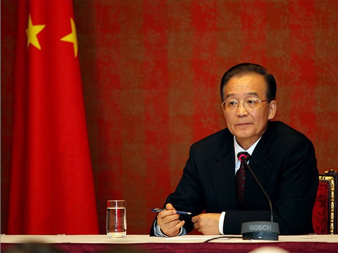 epa03065992 Chinese Prime Minister Wen Jiabao addresses a press conference at the Ritz Carlton Hotel in Doha