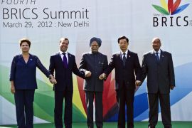 New Delhi, -, INDIA : Heads of the BRICS countries (L to R) President Dilma Rousseff of Brazil, Russian President Dimitry Medvedev, Indian Prime Minister Manmohan Singh, Chinese President Hu Jintao and President Jacob Zuma of South Africa pose prior to the BRICS summit in New Delhi on March 29, 2012. The leaders of BRICS countries gathered for their fourth summit, with the emerging market bloc struggling to convert its growing economic strength into collective diplomatic clout. Brazil, Russia, India, China and South Africa represent 40 percent of humanity, but their grouping faces persistent questions over whether it can unite on key issues given the different priorities of its members. AFP PHOTO / Prakash SINGH