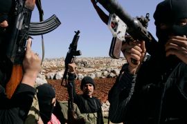 Syrian rebels man a check-point in the north of northern Syria's Idlib region, on March 18, 2012.