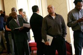 Anthony Bravo (2R) and Antonio Pitchford (R) wait in line to attend the Choice Career Fair held at the Doubletree Hotel on August 19, 2010 in Dallas, Texas. First-time jobless claims rose for the third week in a row, reaching the highest level in nine months.