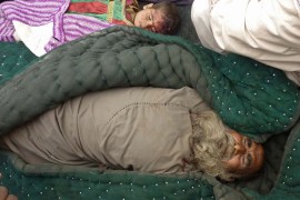 The bodies of an elderly Afghan man and a child are pictured in Alkozai village of Panjwayi district, Kandahar province on March 11, 2012. An AFP reporter counted 16 bodies -- including women and children -- in three Afghan houses after a rogue US soldier walked out of his base and began shooting civilians early Sunday. NATO's International Security Assistance Force said