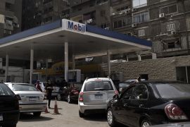 Egyptian drivers cue in their cars to fill up their tanks at a petrol station in downtown Cairo on March 22, 2012. A fuel shortage in the country, that has hit the Egyptian capital the hardest, is leading to traffic congestion at petrol stations as motorists queue up to put fuel in their vehicles.