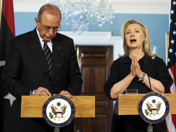 US Secretary of State Hillary Clinton (R) speaks as Libya's interim Prime Minister Abdel Rahim al-Kib looks on during a a joint press briefing following their meeting at the State Department in Washington, DC, on March 8, 2012. Libya is due to hold its first election for a constituent assembly in June in line with a declaration by the ruling National Transitional Council after the ouster of long time strongman Moamer Kadhafi. AFP Photo/Jewel Samad