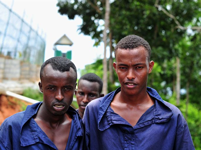 A group of Somali prisoners accused of being pirates and arrested by Seychelles coast guards in the Indian Ocean pose in the Mahe' prison on March 2, 2012. As naval forces tighten the noose around Somali pirates in the Indian Ocean, the idyllic Seychelles archipelago has been overrun with convicted brigands and is calling for international support.