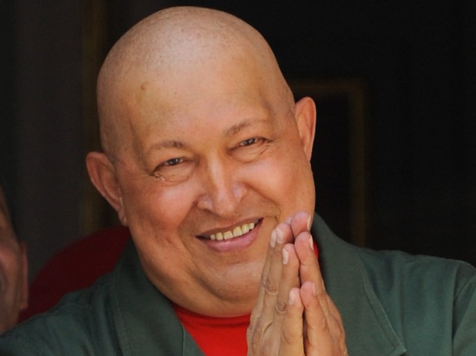 Venezuelan President Hugo Chavez gestures at the Miraflores presidential palace in Caracas on October 1, 2011. Chavez has undergone surgery in Cuba to remove a potentially cancerous lesion and is in "good condition