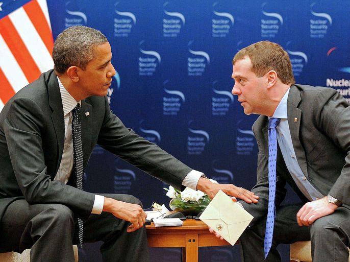 US President Barack Obama speaks to Russian President Dmitriy Medvedev (R) during a bilateral meeting in Seoul on March 26, 2012 on the sidelines of the 2012 Seoul Nuclear Security Summit. Obama and dozens of other world leaders were to begin the 2012 Seoul Nuclear Security Summit on March 26 curbing the threat of nuclear terrorism