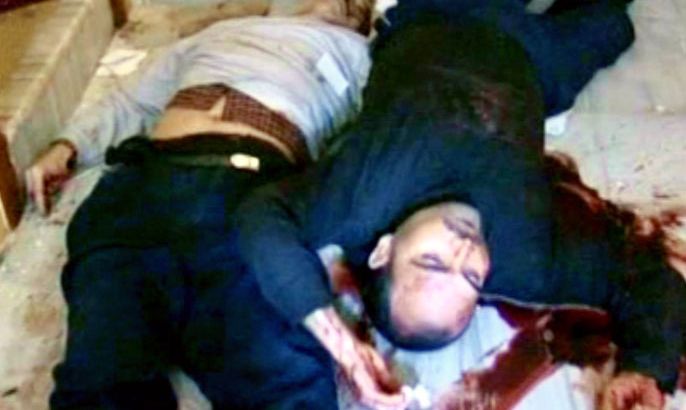 An image released by the official Syrian Arab News Agency (SANA) on March 13, 2012, allegedly shows a still from footage of two dead men on the floor of a house in the Karm al-Luz neighbourhood in the restive city of Homs, where 15 bodies were reportedly found among them a woman with her 4 children. AFP PHOTO/HO-SANA AFP PHOTO/HO -- RESTRICTED TO EDITORIAL USE - MANDATORY CREDIT "AFP PHOTO / HO / SANA" - NO MARKETING NO ADVERTISING CAMPAIGNS - DISTRIBUTED AS A SERVICE TO CLIENTS -- AFP IS USING PICTURES FROM ALTERNATIVE SOURCES AS IT WAS NOT AUTHORISED TO COVER THIS EVENT, THEREFORE IT IS NOT RESPONSIBLE FOR ANY DIGITAL ALTERATIONS TO THE PICTURE'S EDITORIAL CONTENT, DATE AND LOCATION WHICH CANNOT BE INDEPENDENTLY VERIFIED