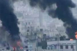 An image grab taken from a video uploaded on YouTube on March 26, 2012, shows smoke billowing from reported shelling by Syrian government forces on a residential area in the flashpoint central city of Homs,