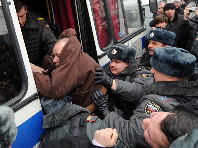 Russian riot arrest on March 31, 2012 opposition activists who were taking part in an unauthorized rally on Triumfalnaya Square in the center of Moscow. Members of the Russian opposition hold protests every 31st of the month in defense of Article 31 of the Russian Constitution, which guarantees freedom of assembly. AFP