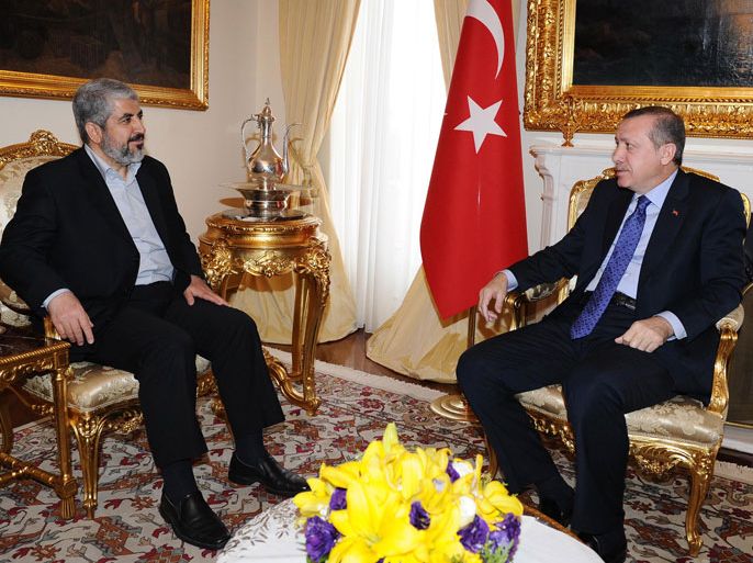 Turkey's Prime Minister Recep Tayyip Erdogan (R) talks with Hamas leader Khaled Meshaal during their meeting in Ankara on March 16, 2012. The Islamic-conservative government led by Erdogan is at odds with Israel, and an ardent defender of the Palestinian cause for establishment of a sovereign Palestinian state. AFP PHOTO/Yasin Bülbül/TURKISH PRIME MINISTER OFFICE RESTRICTED TO EDITORIAL USE - MANDATORY CREDIT "AFP PHOTO /TURKISH PRIME MINISTER OFFICE/ Yasin Bülbül" - NO MARKETING NO ADVERTISING CAMPAIGNS - DISTRIBUTED AS A SERVICE TO CLIENTS