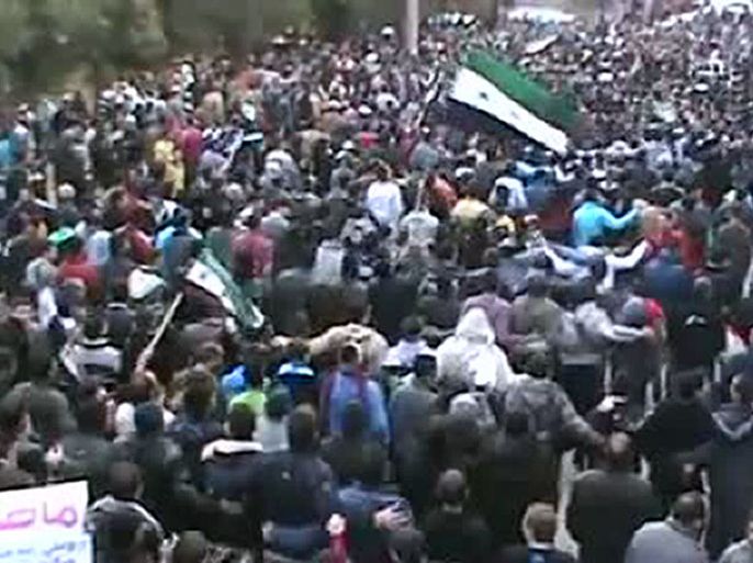 An image grab taken from a video uploaded on YouTube shows Syrian protesters taking part in a rally against Syrian President Bashar al-Assad's regime, to mark the first anniversary of the outbreak of the revolt, in the flashpoint city of Homs on March 16, 2012. Thousands of anti-regime protesters called for foreign military intervention to bring down a Syrian government whose brutal crackdown on dissent monitors say has cost more than 9,100 lives. AFP PHOTO/HO == RESTRICTED TO EDITORIAL USE - MANDATORY CREDIT "AFP PHOTO / YOUTUBE" - NO MARKETING NO ADVERTISING CAMPAIGNS - DISTRIBUTED AS A SERVICE TO CLIENTS - AFP IS USING PICTURES FROM ALTERNATIVE SOURCES AS IT WAS NOT AUTHORISED TO COVER THIS EVENT, THEREFORE IT IS NOT RESPONSIBLE FOR ANY DIGITAL ALTERATIONS TO THE PICTURE'S EDITORIAL CONTENT, DATE AND LOCATION WHICH CANNOT BE INDEPENDENTLY VERIFIED ==