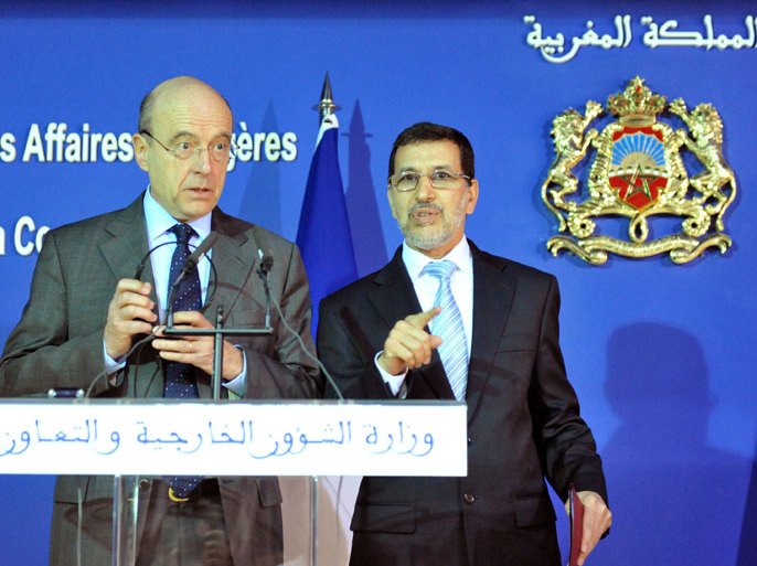 1351 - Rabat, -, MOROCCO : French Foreign Minister Alain Juppe (L) and his Moroccan counterpart Sadd Eddine Othmani attend a press conference in Rabat on March 9, 2012 2012. AFP PHOTO / ABDELHAK SENNA