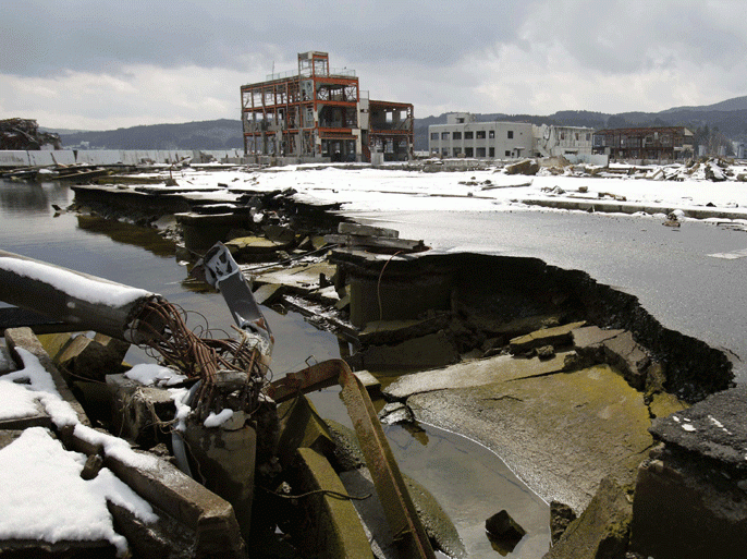 A damaged road is seen in Minamisanriku, northeastern Japan, March 3, 2012. Wave after wave razed the heart of Minamisanriku during the March 11,2011 tsunami, killing around 1,300 of its 17,000 residents. Many survivors still live in more than 40 barrack-style temporary housing settlements dotted on the hills around what was once a lively fishing town. Picture taken March 3, 2012. REUTERS/Yuriko Nakao (JAPAN - Tags: DISASTER ANNIVERSARY)