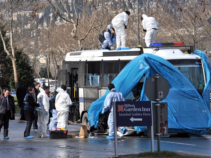 Turkish forensic police search near the bus after an explosion in Istanbul, on March 1, 2012. A remote-controlled bomb explosion near a police bus wounded 10 people, mostly policemen, in Istanbul early Thursday, in what seems to be an attack targeting security forces, Istanbul police said