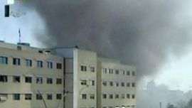 An image grab taken off the official Syrian TV on March17, 2012, shows smoke billowing from a building following twin bombings in the Syrian capital which killed several civilians and police, state television said without giving figures, amid fears Al-Qaeda is trying to exploit the anti-regime revolt. AFP PHOTO