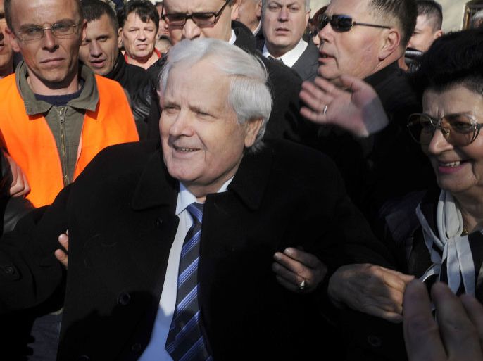 Fikret Abdic (C) is welcomed by his supporters, after serving his sentence and leaving a prison in northern Adriatic Croatian town of Pula, on March 9, 2012. Abdic, a Bosnian Muslim, was convicted as war criminal after being accused of imprisoning some 5,000 people in detention camps, at least three of whom died due to maltreatment during 1992-1995 Bosnia’s war. During the war, Abdic was a militia leader who set up a self-proclaimed state known as the "Autonomous Region of West Bosnia” who fled to Croatia in 1995 following his military defeat. In 2002, a Croatian court sentenced him to 20 years in prison. AFP PHOTO/ Hrvoje POLAN
