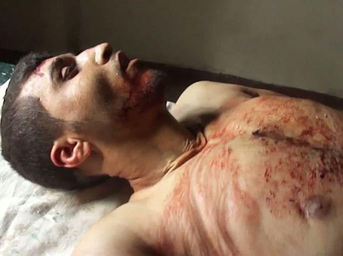 Hama, -, SYRIA : An image grab taken from a video uploaded on YouTube shows the body of a Syrian man identified by activists as Bilal Ahmad al-Atuk allegedly killed by Syrian pro-regime forces in the Syrian central city of Hama on March 28, 2012. Syrian troops stormed a rebel bastion as United Nations chief Ban Ki-moon urged President Bashar al-Assad to "immediately" implement a UN-Arab League peace plan he reportedly accepted. AFP PHOTO/HO == RESTRICTED TO EDITORIAL USE - MANDATORY CREDIT "AFP PHOTO / YOUTUBE" - NO MARKETING NO ADVERTISING CAMPAIGNS - DISTRIBUTED AS A SERVICE TO CLIENTS - AFP IS USING PICTURES FROM ALTERNATIVE SOURCES AS IT WAS NOT AUTHORISED TO COVER THIS EVENT, THEREFORE IT IS NOT RESPONSIBLE FOR ANY DIGITAL ALTERATIONS TO THE PICTURE'S EDITORIAL CONTENT, DATE AND LOCATION WHICH CANNOT BE INDEPENDENTLY VERIFIED