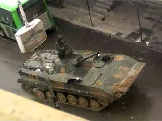 An image grab taken from a video uploaded on YouTube on March 1, 2012 shows a Syrian army tank rolling through a street in Dumeir