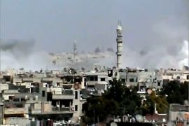 An image grab taken from a video uploaded on YouTube on April 19, 2012, shows smoke rising from reported shelling by Syrian government forces on the district of Bayada in the flashpoint central city of Homs. Secretary of State Hillary Clinton said on April 19, world powers should push for tough United Nations sanctions against Syria in order to force President Bashar al-Assad's regime to comply with a UN peace plan. AFP PHOTO/YOUTUBE