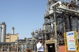 A file photograph showing an Iranian security guard walking in front of the Mahshahr petrochemical complex in Khuzestan province south western Iran, 28 September 2011. Media reports state on 29 January 2012 that a bill to stop oil sales to European Union countries involved in the oil embargo initiative against Iran was ready to be approved by the Iranian Parliament. The energy commission of parliament prepared the bill on 25 January 2012, and commission deputy chairman Nasser Soudani said the bill was ready for voting in the parliamentâ×s session on 29 January 2012. EPA/ABEDIN TAHERKENAREH Local Caption 00000402940308