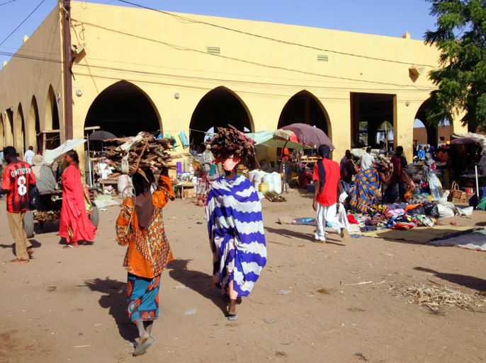 (FILES) -- A file photo taken on November 16, 2006 shows women arriving at Gao's market. Tuareg rebels confirmed on April 1, 2012 they had taken control of Gao and said they'd encircled Timbuktu, the last city in Mali's north not to fall to their sweeping advance. Gao was rocked by heavy gunfire on March 31 and fell after the head of the junta that seized power in Bamako on March 22 ordered the army not to fight the advance. AFP