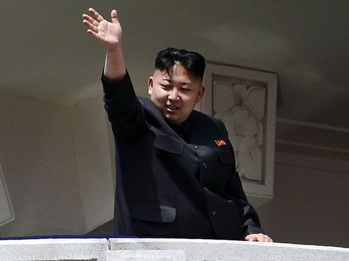 North Korea's leader Kim Jong-Un waves at the end of a major military parade to mark 100 years since the birth of the country's founder and his grandfather, Kim Il-Sung, in Pyongyang on April 15, 2012. The commemorations came just two days after a satellite launch timed to mark the centenary fizzled out embarrassingly when the rocket apparently exploded within minutes of blastoff and plunged into the sea. AFP PHOTO / PEDRO UGARTE
