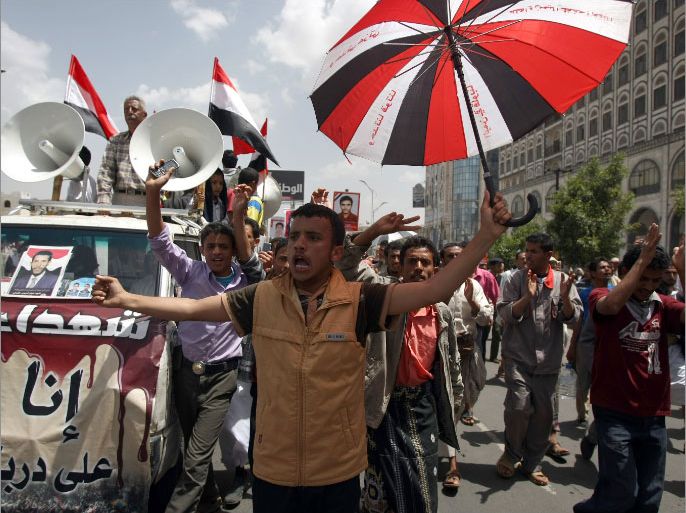 Yemenis take part in an anti-government protest demanding Yemen's former President Ali Abdullah Saleh, who was forced from power in February, be put on trial, in the capital Sanaa, on April 26, 2012.