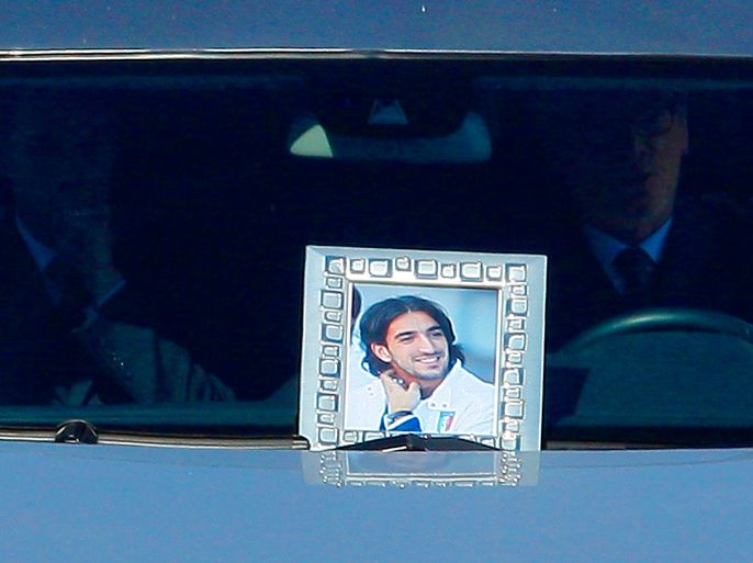 A portrait of late Livorno footballer Piermario Morosini is displayed on the front window of the hearse during a ceremony on April 17, 2012 at the Armando Picchi stadium in Leghorn. Morosini collapsed and died during a match on April 14. AFP