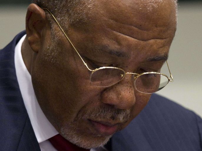 Former Liberian President Charles Taylor takes note at the start of the judgement hearing of his trial on charge of arming Sierra Leone's rebels who paid him in "blood diamonds," on April 26, 2012 at the Special Court for Sierra Leone, based in Leidschendam outside The Hague. Taylor, 64, is accused of helping Sierra Leone's Revolutionary United Front (RUF) rebels wage a terror campaign during a civil war that claimed 120,000 lives between 1991 and 2001. Taylor listened attentively and made notes as judge Richard Lussick started reading a summary of the verdict, the first ever against a former head of state by an international court. AFP