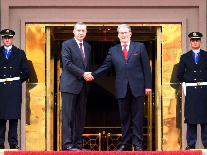 Turkey's Prime Minister Tayyip Erdogan (L) shakes hands with Albanian Prime Minister Sali Berisha during a welcoming ceremony in Ankara on April 5, 2012. AFP PHOTO / ADEM ALTAN