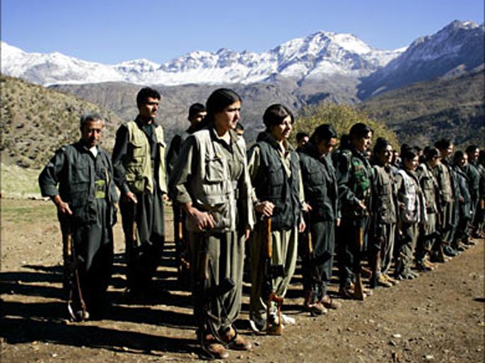 f_pkk guerillas assemble for roll call at their base deep in the mountains of northern iraq's kurdish autonomous region, 17 november 2006. high in the mountains of northern iraq, the kurdish fighters of the kurdistan workers party (pkk) expressed defiance today over the comments of iraqi and turkish officials about removing the guerilla organization from its bases. (الفرنسية)