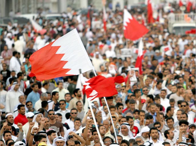 Hundreds of supporters of Bahrain's main opposition group Al-Wefaq wave national flags during a pro-democracy demonstration on April 15, 2012 in Shiite villages on the outskirts of the capital Manama. The protest was the first in a week of daily rallies and sit-ins called by Al-Wefaq, the Gulf kingdom's largest Shiite bloc, under the banner of "steadfastness and challenge" planned to last through the end of the controversial F1 Grand Prix race scheduled for April 22. AFP PHOTO /HO -- RESTRICTED TO EDITORIAL USE - MANDATORY CREDIT "AFP PHOTO / HO / AL-WEFAQ " - NO MARKETING NO ADVERTISING CAMPAIGNS - DISTRIBUTED AS A SERVICE TO CLIENTS
