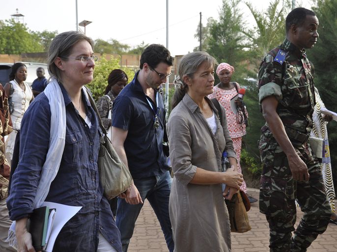 Swiss hostage Beatrice Stockly (2ndR) walks upon her arrival at Ouagadougou airport on April 24, 2012. Special forces from Burkina Faso swept into rebel-held northern Mali aboard a helicopter and whisked a Swiss hostage to safety in a pre-arranged handover by Islamist rebels. AFP