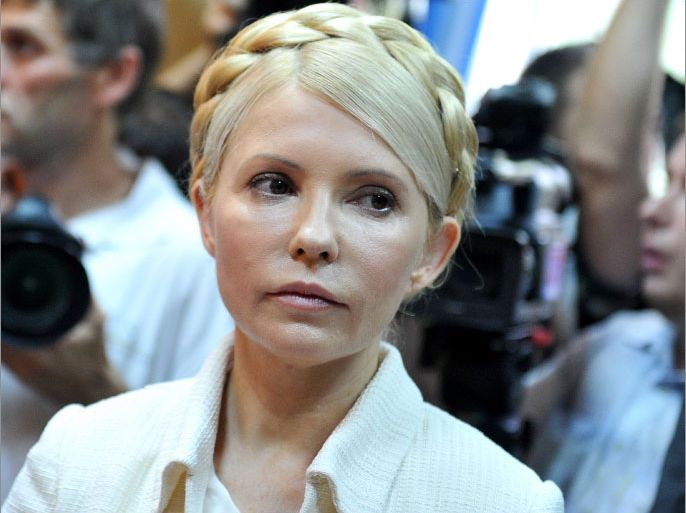 (FILES) In this photograph taken on June 24, 2011 Ukraine's ex-prime minister Yulia Tymoshenko looks on at the beginning her court hearing in Kiev. Ukraine's jailed opposition leader Yulia Tymoshenko began receiving back pain treatment in hospital on April 21, 2012 after missing the controversial opening of her new trial for tax fraud. AFP PHOTO/ SERGEI SUPINSKY