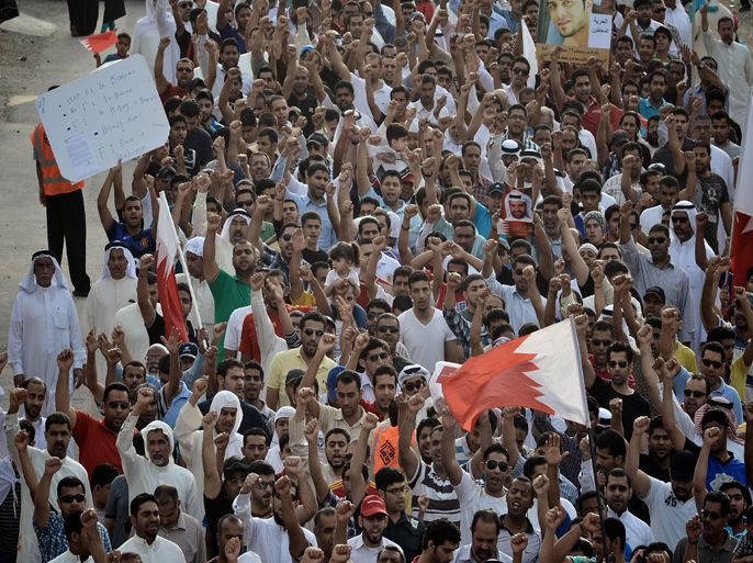 Shiite Muslims take part in a demonstration calling for canellation of the upcoming Bahrain F1 Grand Prix, on April 17, 2012, in the town of Muharraq