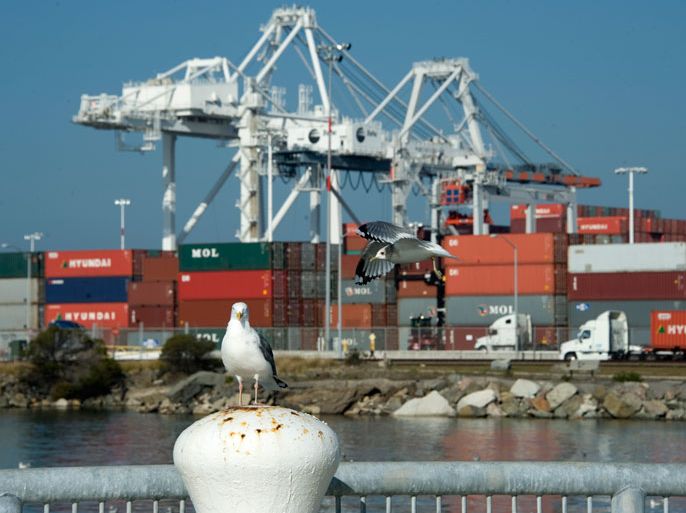 epa03054864 Seagulls with the backdrop of the Port of Oakland in Oakland, California, USA 09 January 2012. Ships that call at this terminal come from Asia with containers full of consumer products. Ships makes stops at both Los Angeles and Oakland to unload cargo and pick up US exports, generally agricultural products, and empty containers returning to Asia. A further sign of positive developments in US economic sector, the US unemployment rate dropped to 8.5 per cent in December, from 8.6 per cent the previous month, the US Labour Department said 06 January. EPA/JOHN G. MABANGLO