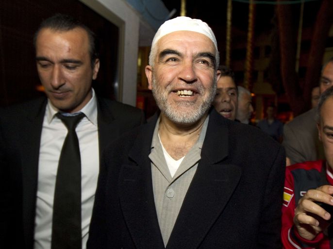 Arab-Israeli Islamist leader Sheikh Raed Salah (C) is welcomed by hundreds supporters, at Ben Gurion airport near Tel Aviv on April 16, 2012. Salah, the leader of the radical wing of the Islamic Movement in Israel, was detained in London on charge of entering the country illegally and he now faces deportation from Britain. AFP