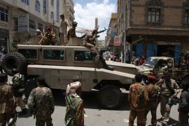 Yemeni forces patrol with an armored vehicle in the capital Sanaa on April 7, 2012. According to an airport source, the airport in the Yemeni capital was closed after threats by forces loyal to a general close to former president Ali Abdullah Saleh to attack aircraft landing or taking off. AFP PHOTO/MOHAMMED HUWAIS