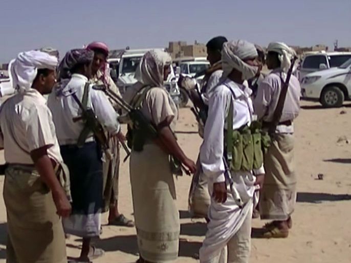 A picture taken on April 10, 2012 with a mobile phone shows a Yemeni tribal gunmen helping the government forces in their battle against the Al-Qaeda network gathering in the southern town of Loder in Yemen's Abyan province where at least 124 people were killed in 48 hours of clashes sparked when militants linked to Al-Qaeda raided an army barracks there on April 9. Yemeni soldiers backed by tribesmen fought over the past two days the extremists who vowed to retake a strategic town. AFP PHOTO/STR