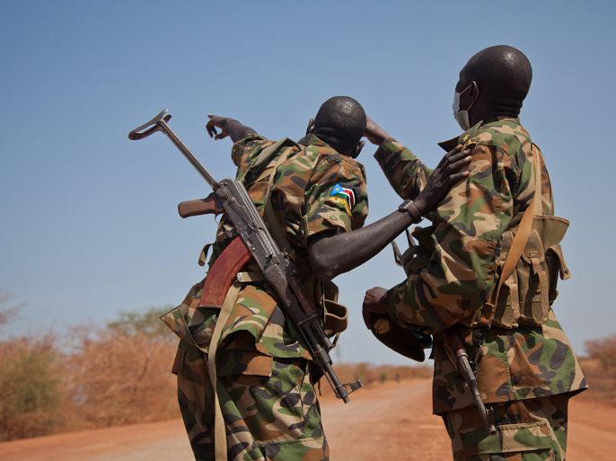 A picture taken on April 17, 2012 shows soldiers of the South-Sudan's Sudan People's Liberation Army (SPLA) pointing towards a circling Antonov in Heglig. Silence has followed Sudan's announcement four days ago that it had begun a counterattack towards the oil centre of Heglig seized by Southern troops. The army spokesman remained unreachable by telephone for a third day on April 17, and has not given a press briefing since April 14 when he said his forces were kilometres (miles) from Heglig town seized on April 10 by the South. Heglig is Sudan's most important oil centre but the attack on April 10 caused a total production shutdown in the area, said Ahmed Haroun, the South Kordofan governor. AFP