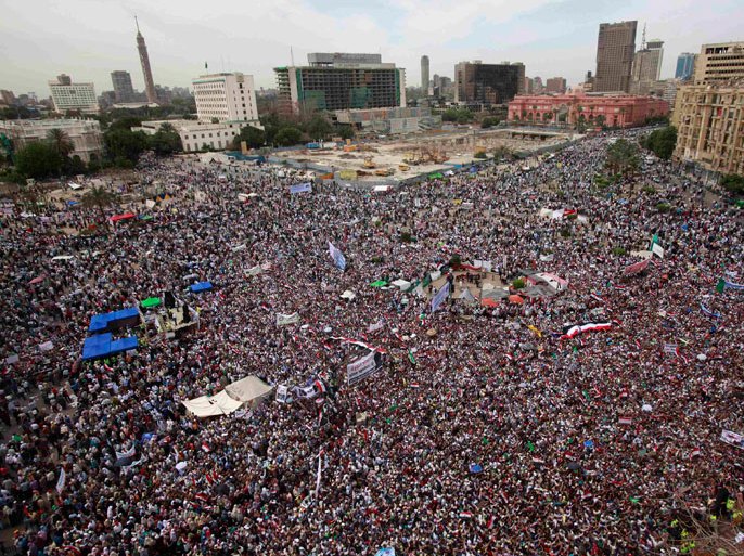 People gather for a mass protest in Tahrir square in Cairo April 13, 2012. Thousands of Egyptians packed into Cairo's Tahrir Square on Friday to protest against a run for the presidency by former intelligence chief Omar Suleiman, in an Islamist show of strength against Hosni Mubarak's old guard
