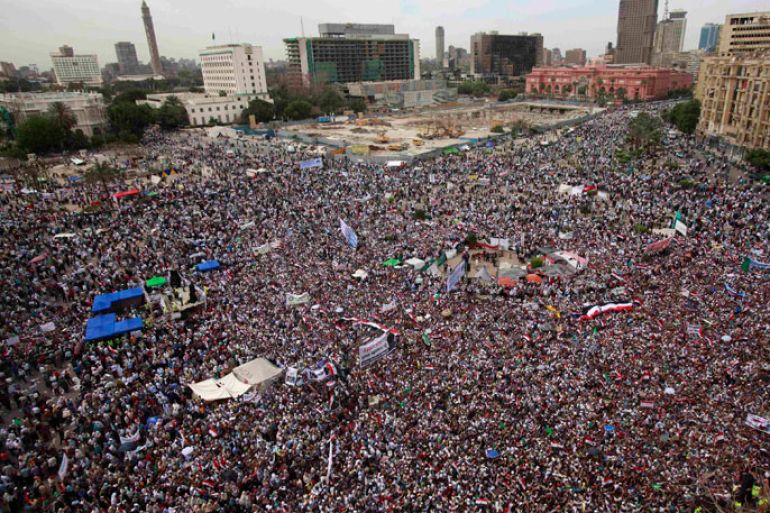 People gather for a mass protest in Tahrir square in Cairo April 13, 2012. Thousands of Egyptians packed into Cairo's Tahrir Square on Friday to protest against a run for the presidency by former intelligence chief Omar Suleiman, in an Islamist show of strength against Hosni Mubarak's old guard